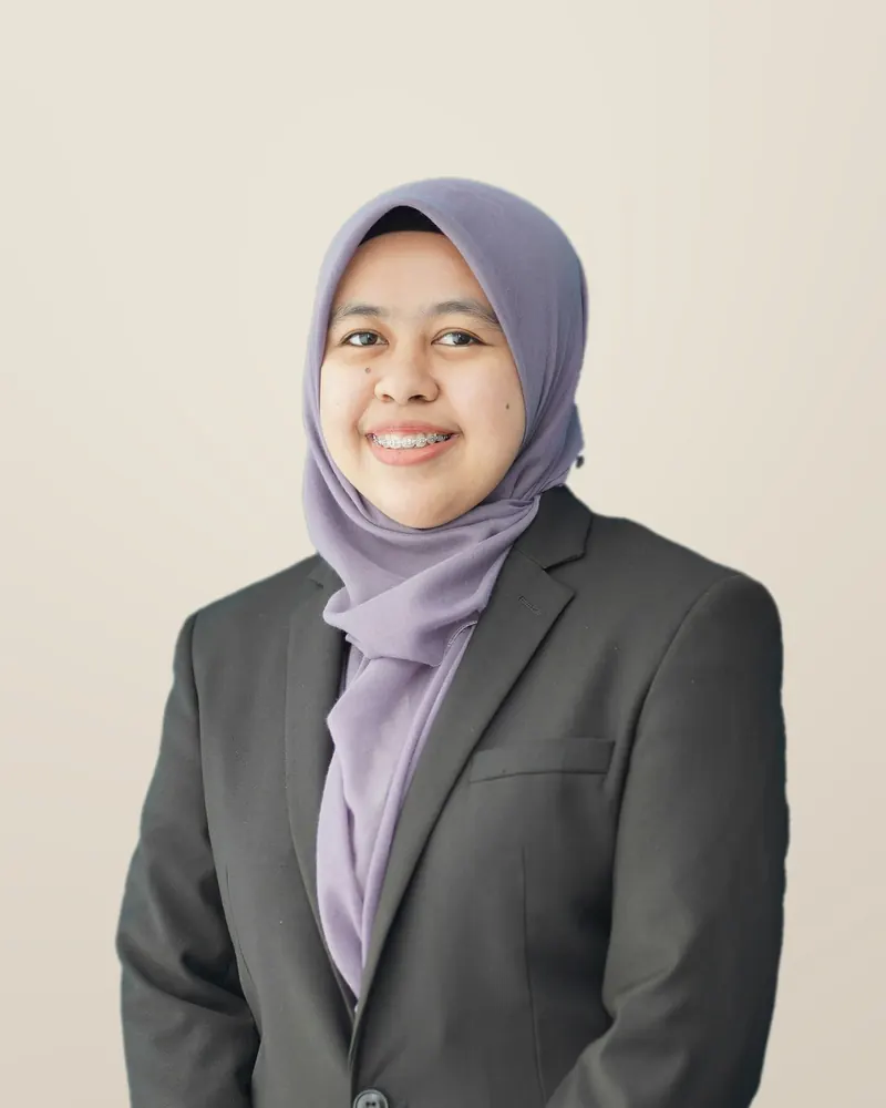 Aisyah Kamal, founder of Dar Properties, in a dark suit and lilac headscarf
